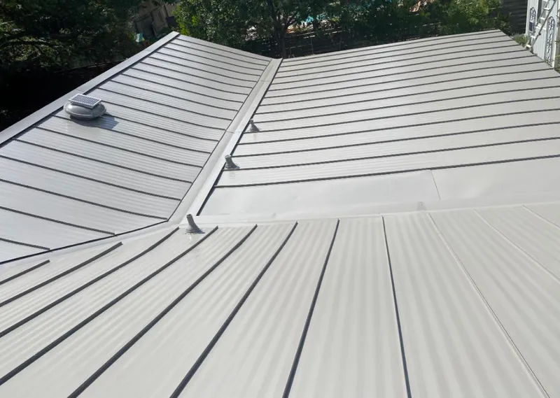 Solar attic fan installed on a metal roof for Roof Ventilation in West Ocean City